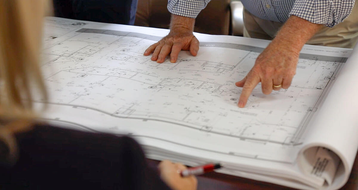 architectural documents being reviewed for preconstruction services